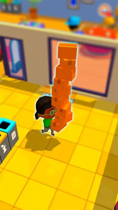 A shopkeeper carrying a tall stack of boxes across a yellow store floor